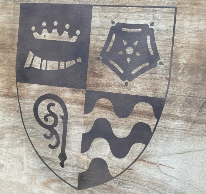 Kingsclere Primary school crest applied to a timber panel